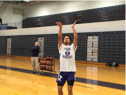 Tallwood basketball students practice in the gym after school.