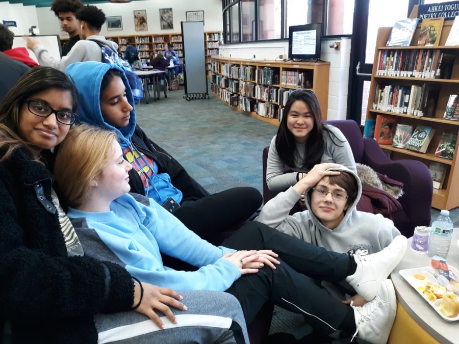 Students in the LMC wear their hoodies as they discuss their thoughts on the new hoodie policy.