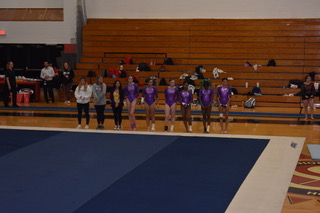 Members of the Tallwood Gymnastics team prepare for their meet.