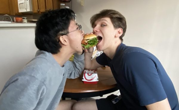 The writer and fellow Tallwood student, Anthony Chu, enjoy a spicy chicken sandwich.