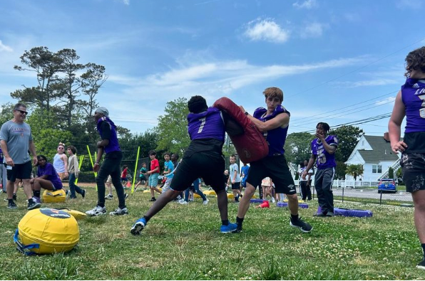 Tallwood football team hosts field day for Cook Elementary